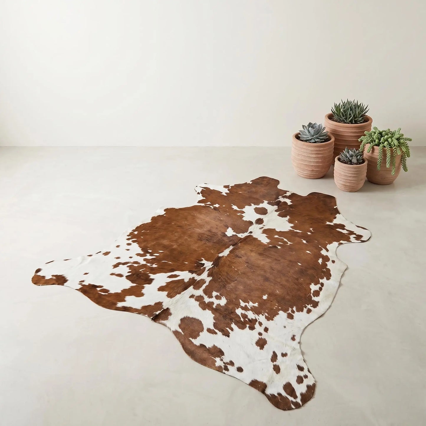 Elevate Your Space with a Genuine, One-of-a-Kind Natural Cowhide Rug