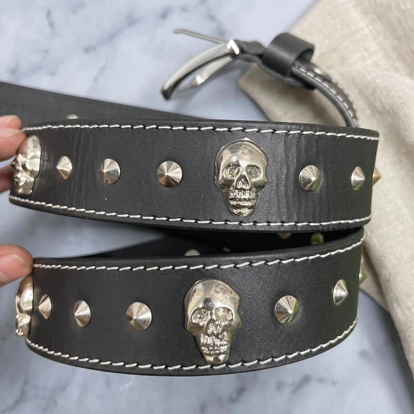 Unbridled Attitude: Handcrafted Skull Studded Leather Belt